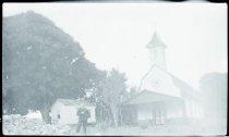 Father Remy Mattheeuws, SS.CC., in front of Saint Gabriel Church, Keanae, Maui.